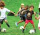 Happy Kids playing soccer